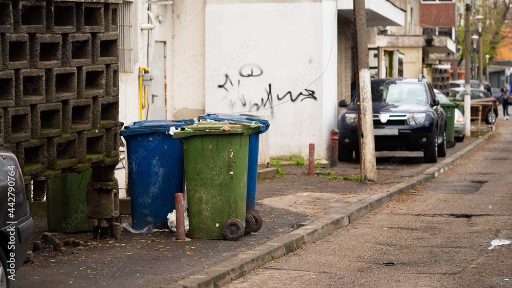 Three dumpsters, outdoor with sunlight background. Three dumpsters, outdoor with sunlight background.