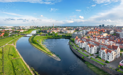 Poznan, Poland. Aerial view of Warta river and residential buildings in the district of Old Port © bbsferrari