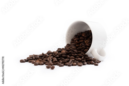 Coffee mug fulled of coffee beans isolated
