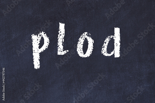 College chalk desk with the word plod written on in
