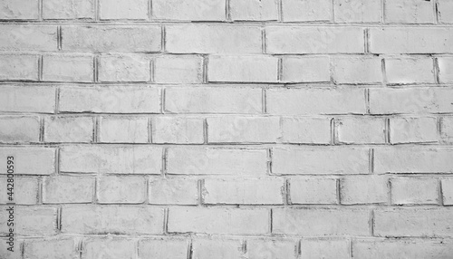 White brick wall background. Detail of a white brick wall texture. Grunge white brick backdrop. Surface of gray brick wall