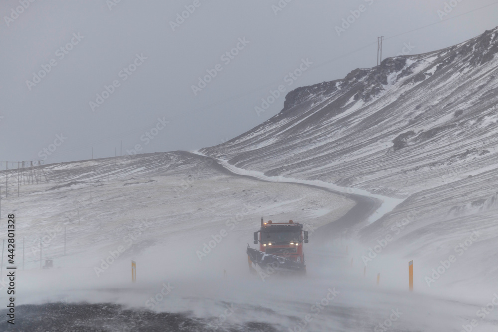 snowplow working in the middle of the storm snowplow working in the middle of the storm
