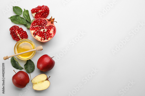 Flat lay composition with Rosh Hashanah holiday attributes on white background. Space for text