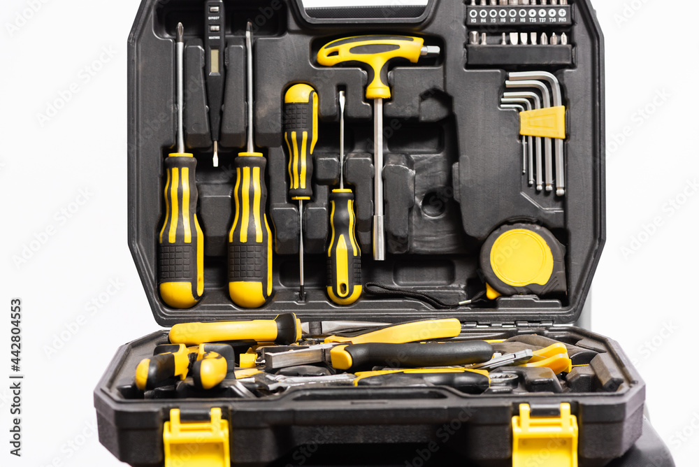 A toolbox with a work tools close up background. A toolbox with a work tools close up background.