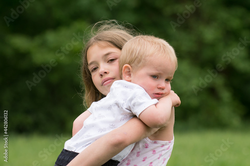 Wallpaper Mural Crying children, sad siblings - sister with little baby brother. Torontodigital.ca