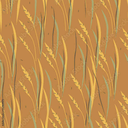 Autumn hand drawn abstract cartoon wheat with leaves seamless pattern. Vector illustration on brown background