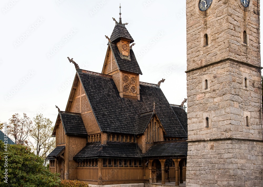 Old wooden Church against the backdrop of the Polish mountains