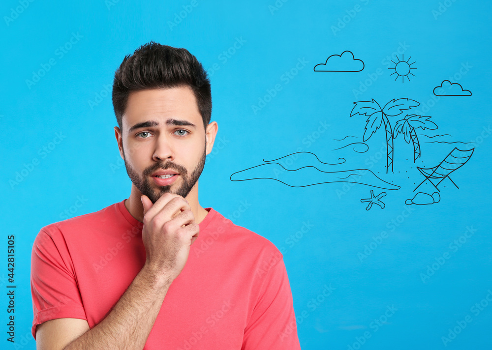 Young man dreaming about vacation on blue background Young man dreaming about vacation on blue background