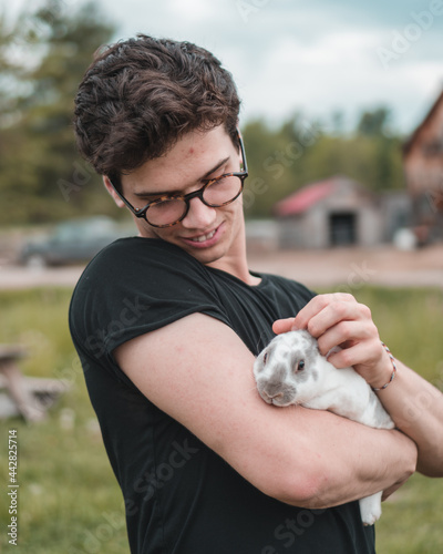 Bunny being held by person