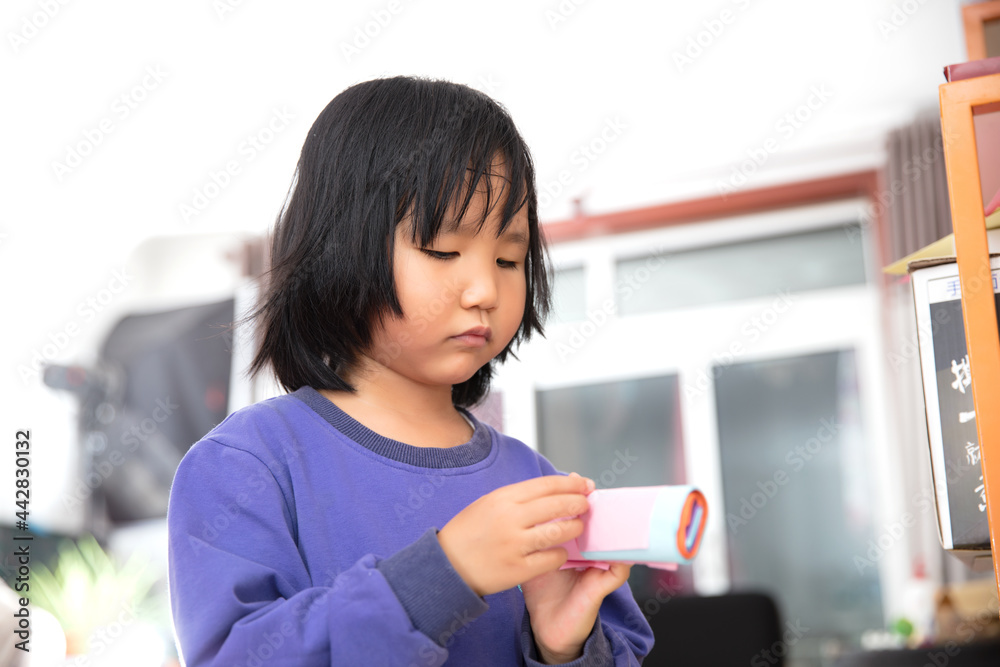 Cute little girl is crafting her gift Cute little girl is crafting her gift