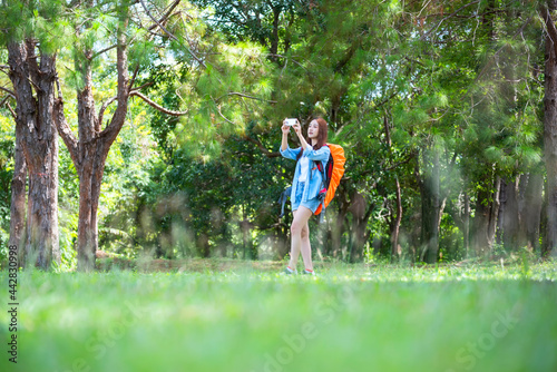 Fototapeta Naklejka Na Ścianę i Meble -  Hiker with backpack relaxing young woman hiking holiday