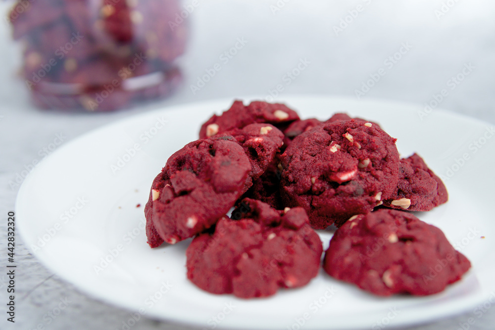 Red velvet cookies with background decoration. Selective focus. Red velvet cookies with background decoration. Selective focus.