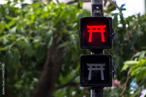 Pedestrian traffic light stylized with oriental themes in Liberdade neighborhood, Japanese and other Asian immigrants reside, Sao Paulo, Brazil photo