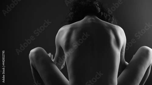 Sexy woman back shadow. Shadow woman. Erotic. Passionate concept. Dark.  photo
