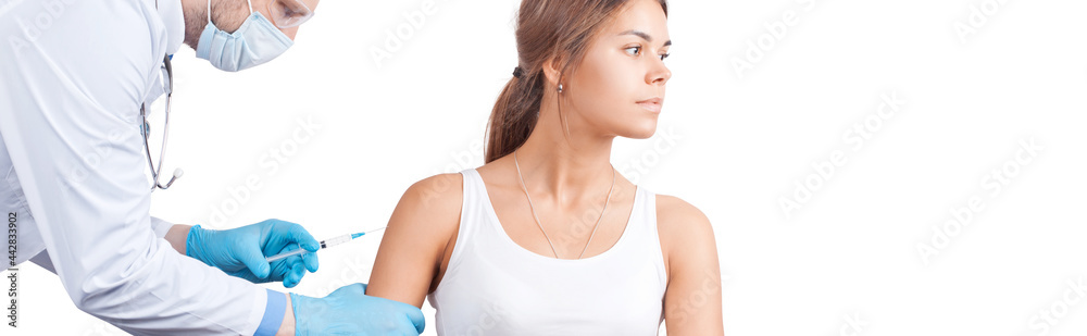 Doctor gives a syringe with vaccine to patient at clinic. Doctor gives a syringe with vaccine to patient at clinic.