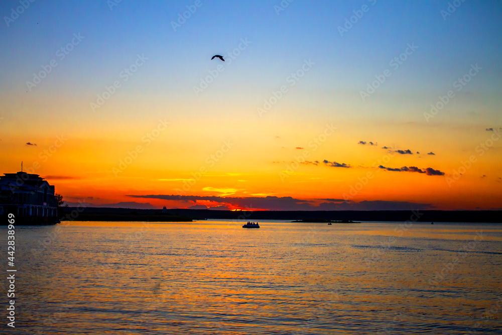 Sunset on the river, lake in artistic processing Sunset on the river, lake in artistic processing