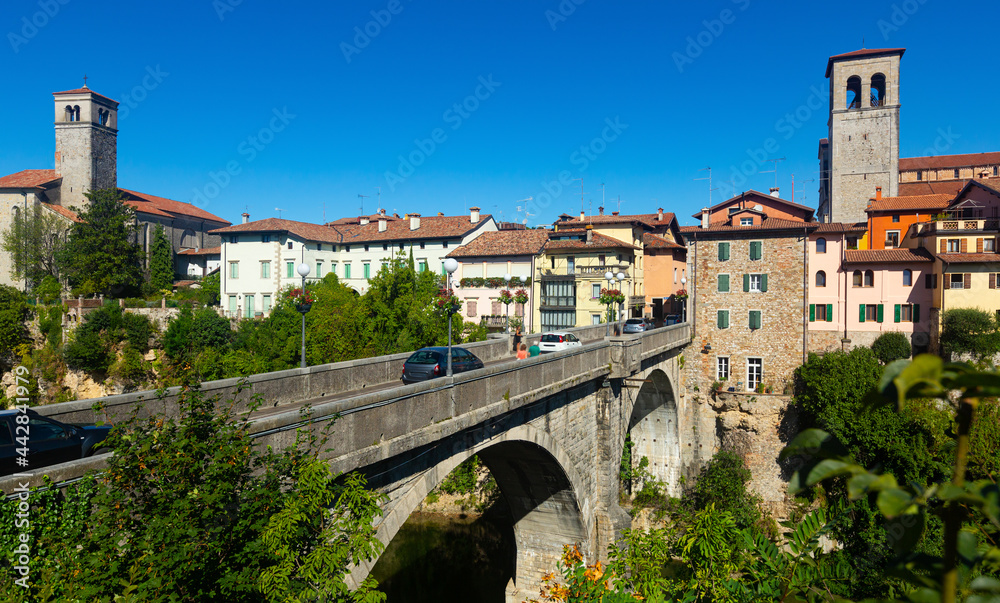 Scenic view of ancient arched bridge Ponte del Diavolo across Natisone river in small Italian town of Cividale del Friuli