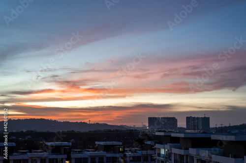 Bangi, Malaysia - June 14, 2021 Beautiful scenery of sunset sky near Bandar Seri Putra. © ellinnur