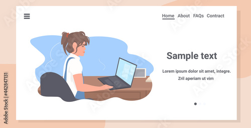 young woman freelancer sitting at workplace using laptop coronavirus quarantine freelance concept