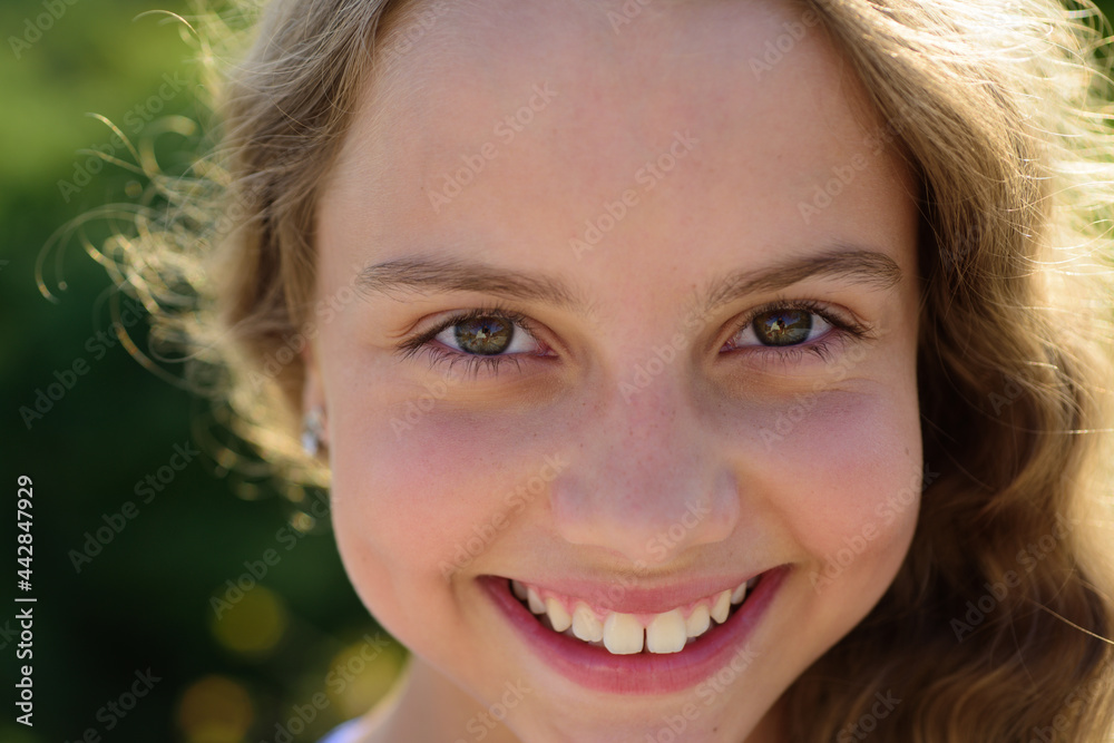 Happy smiling girl portrait. People emotions concept.