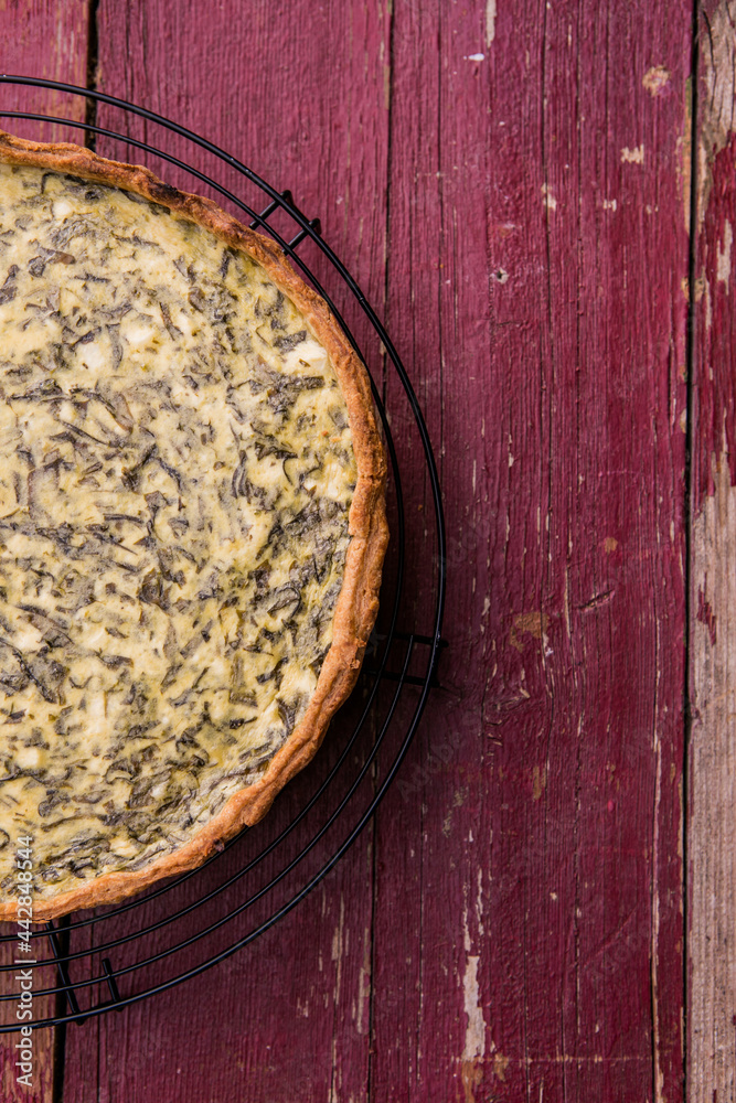 Quiche with spinach - traditional dish of french cuisine. Spinach tart Quiche with spinach - traditional dish of french cuisine. Spinach tart