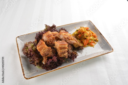 deep fried crispy pork belly crawling with nonya achar salad asian roasted menu photo