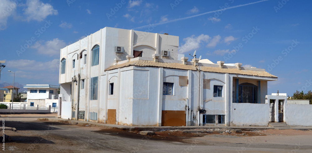 Residential non tourist area. White apartment buildings. Sharm El Sheikh, Egypt 