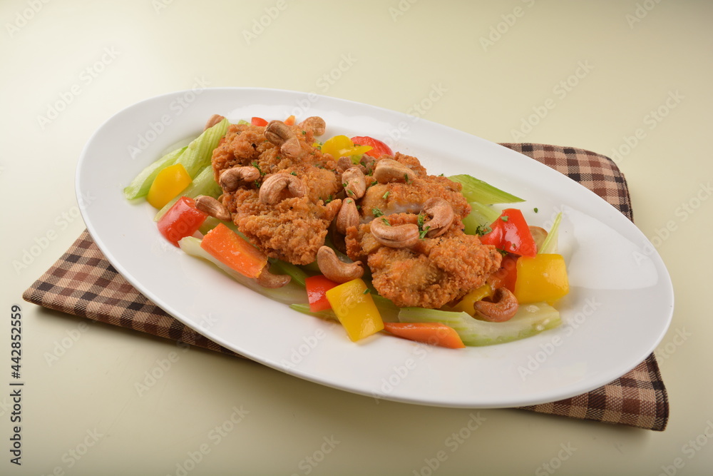 deep fried chicken cutlet chop with cashew nut and vegetables main course asian halal menu deep fried chicken cutlet chop with cashew nut and vegetables main course asian halal menu