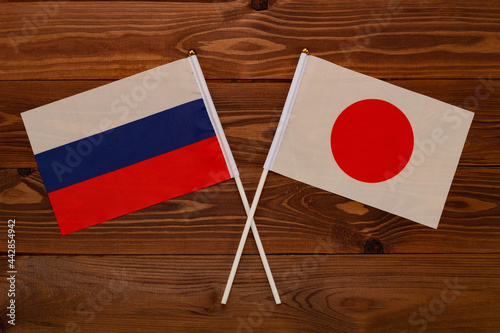 Flag of Russia and flag of Japan crossed with each other. The image illustrates the relationship between countries. Photography for video news on TV and articles on the Internet and media. Free Download Flag of Russia and flag of Japan crossed with each other. The image illustrates the relationship between countries. Photography for video news on TV and articles on the Internet and media. - GFXLoad