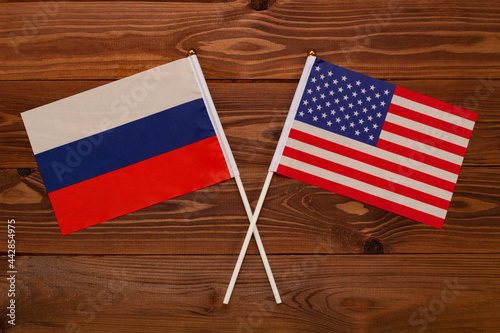 Flag of Russia and flag of USA crossed with each other. The image illustrates the relationship between countries. Photography for video news on TV and articles on the Internet and media.