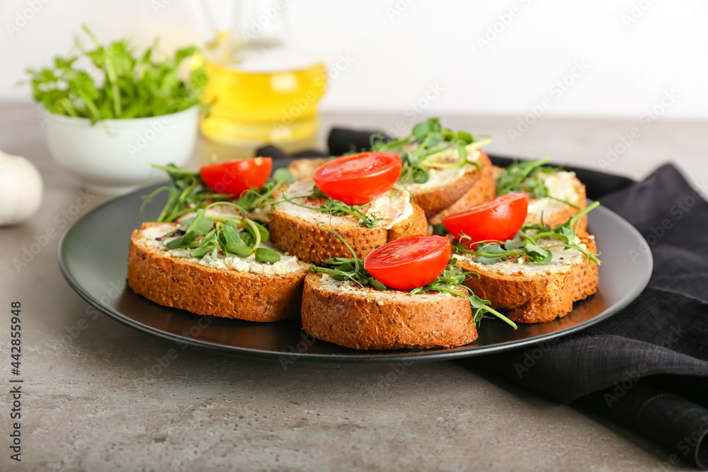 Plate with tasty toasts on grunge background Plate with tasty toasts on grunge background
