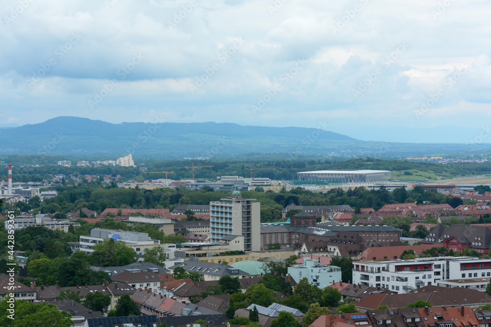 Freiburg im Breisgau, June 29, 2021: The Rhine Valley with the new SC Freiburg stadium and a cloudy sky just before a violent thunderstorm.