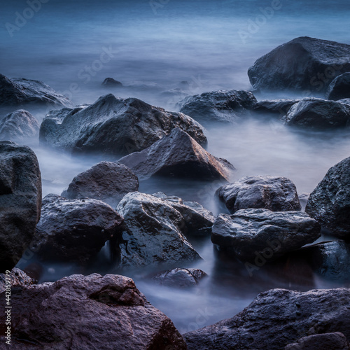 rocks on the beach at sunset © Marlon P. Canon
