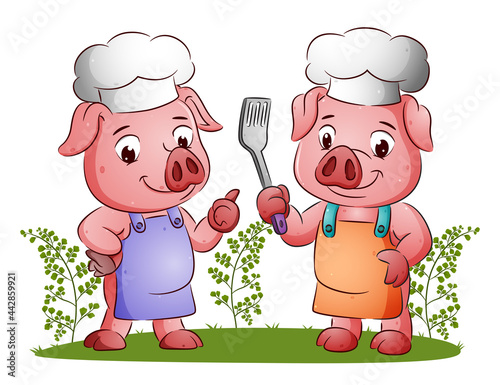 The couple of chef pigs are holding the spatula and giving the happy expression