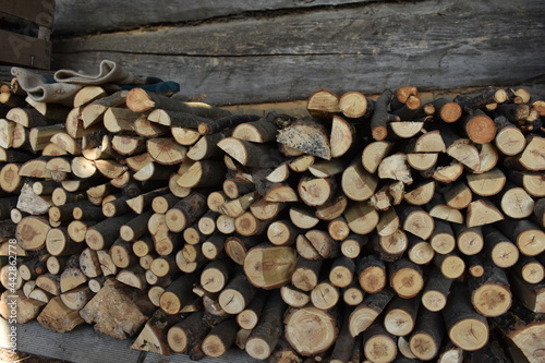 stack of firewood,chopped firewood, pieces of wood, timber, for burning in a stove, fireplace
