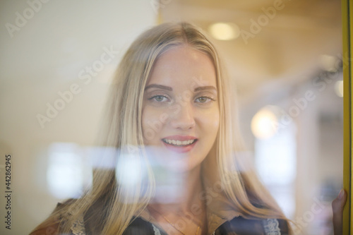 portrait of a beautiful fashion girl with blonde hair posed indoor.