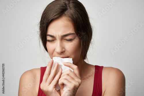 woman with hammer cold runny nose health problems treatment