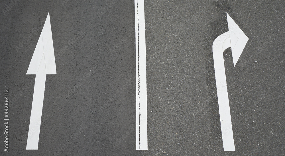 Arrow signs on the road surface to indicate the destination