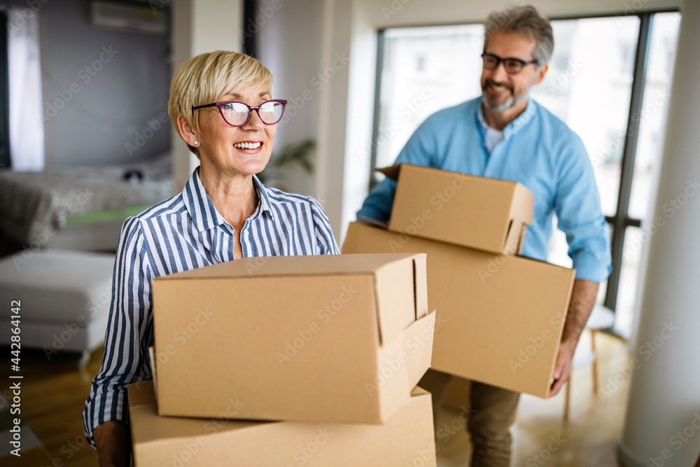 Happy retired senior couple moving into a new home, apartment. Happy retired senior couple moving into a new home, apartment.