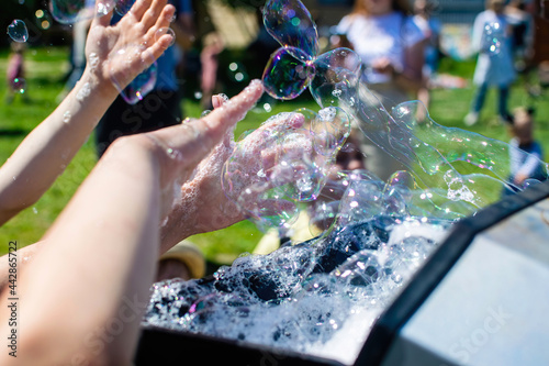 Machine generator for soap bubbles at the children's holiday. photo