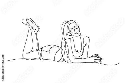 Happy young woman in light summer clothing lying down and smiling. Continuous line art drawing style. Relax time. Minimalist black linear sketch isolated on white background. Vector illustration