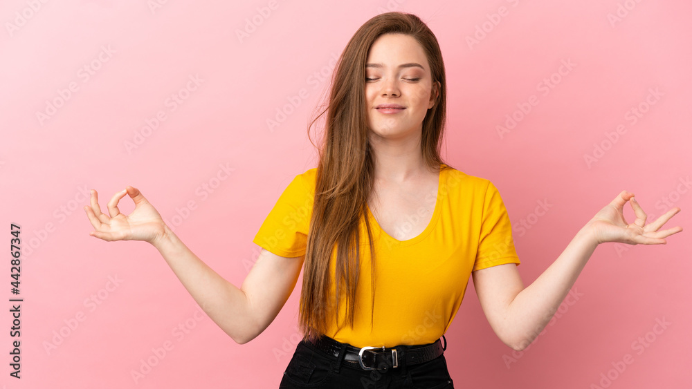 Teenager girl over isolated pink background in zen pose Teenager girl over isolated pink background in zen pose