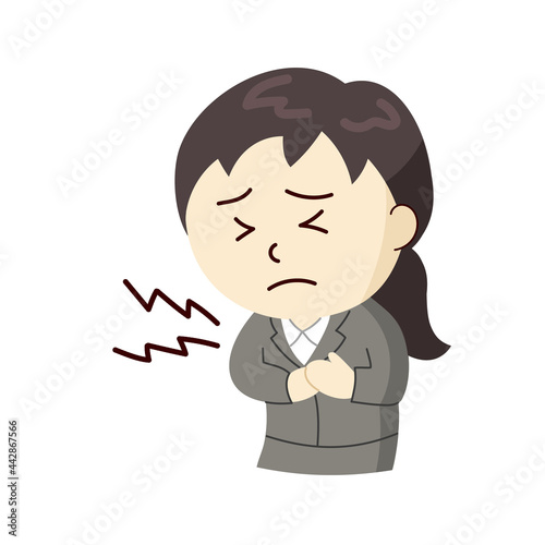 痛みで胸を押さえるスーツ姿の女性