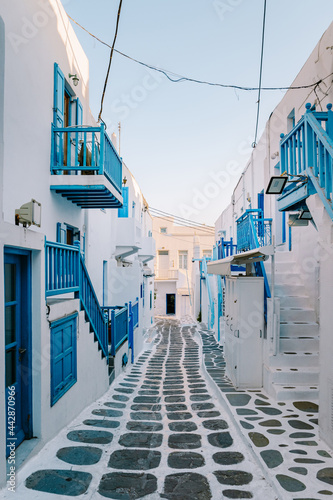 Fototapeta Naklejka Na Ścianę i Meble -  Mykonos Greece, colorful streets of the old town of Mykonos, Traditional narrow street with blue doors and white walls, Mykonos town Greece 