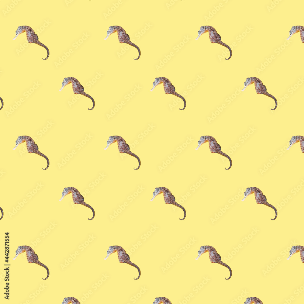 Colorful cotton fabric with fish pattern on yellow for background or texture