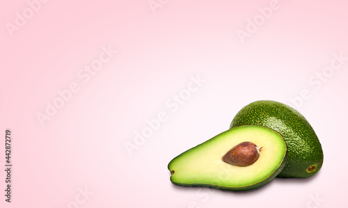 Composition of ripe avocados on a bright background.