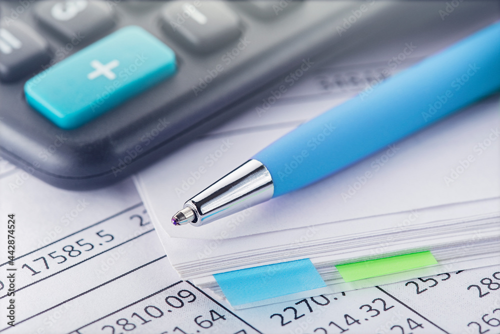 accounting document with pen and calculator. Concept of banking, financial report and financial audit. accounting document with pen and calculator. Concept of banking, financial report and financial audit.