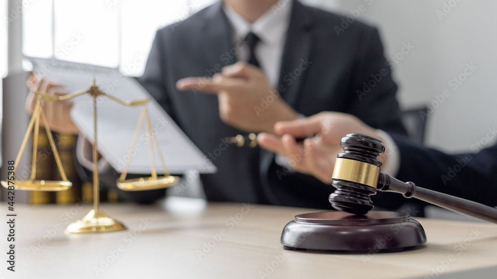 Attorney or judge provides legal advice to the client in the courtroom, Ethics in the courts include justice and impartiality, legal consultant, scales of justice, law hammer, Litigation and justice. Attorney or judge provides legal advice to the client in the courtroom, Ethics in the courts include justice and impartiality, legal consultant, scales of justice, law hammer, Litigation and justice.