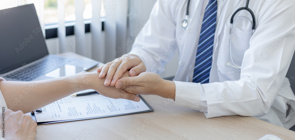 Male doctor specializing in psychiatrist comforts an anxious depression patient for medical treatment in a hospital diagnostic room, Medical treatment and health care concept. Male doctor specializing in psychiatrist comforts an anxious depression patient for medical treatment in a hospital diagnostic room, Medical treatment and health care concept.