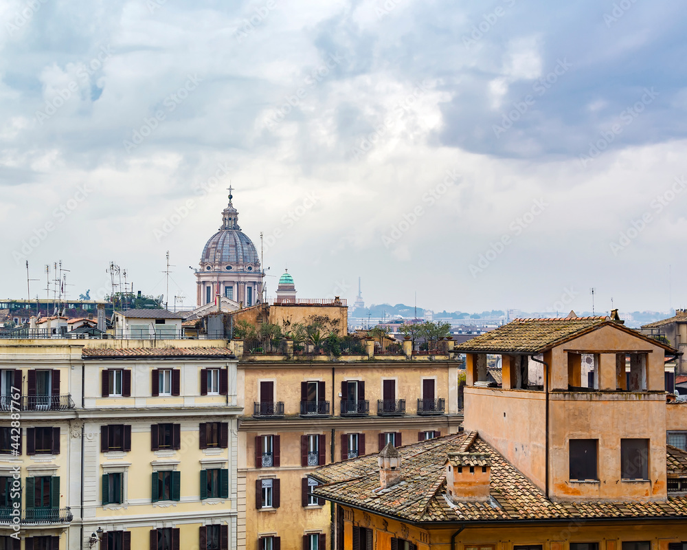 A view of the rome and the dome of the San Carlo al Corso basilica church as seen from the piazza della  Trinita dei Monti, Rome, Italy
